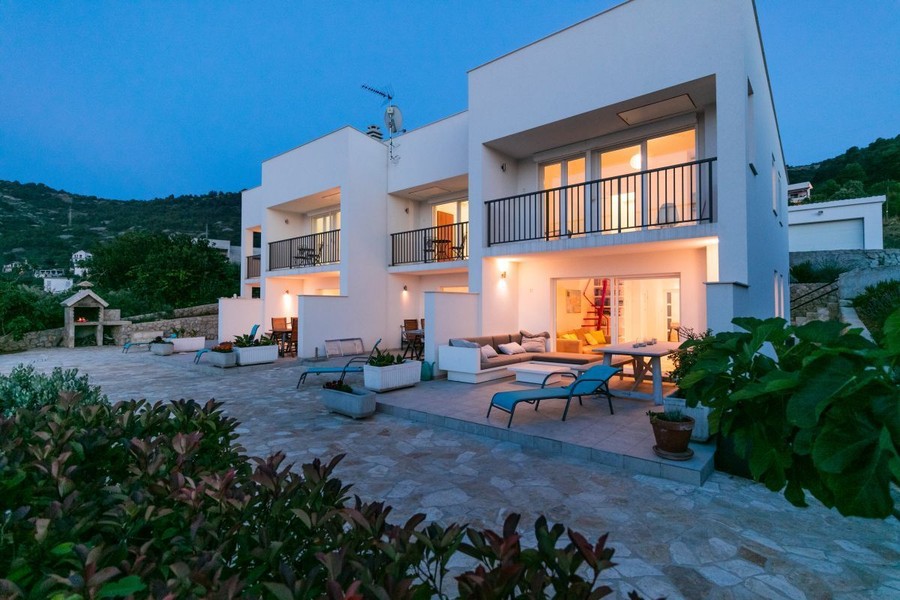 House with terraces and balconies at dusk