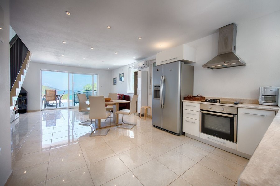 Open-plan kitchen with dining area