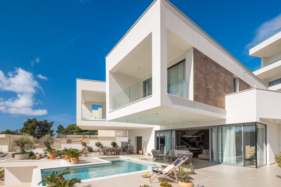 Modern villa with glass front and pool