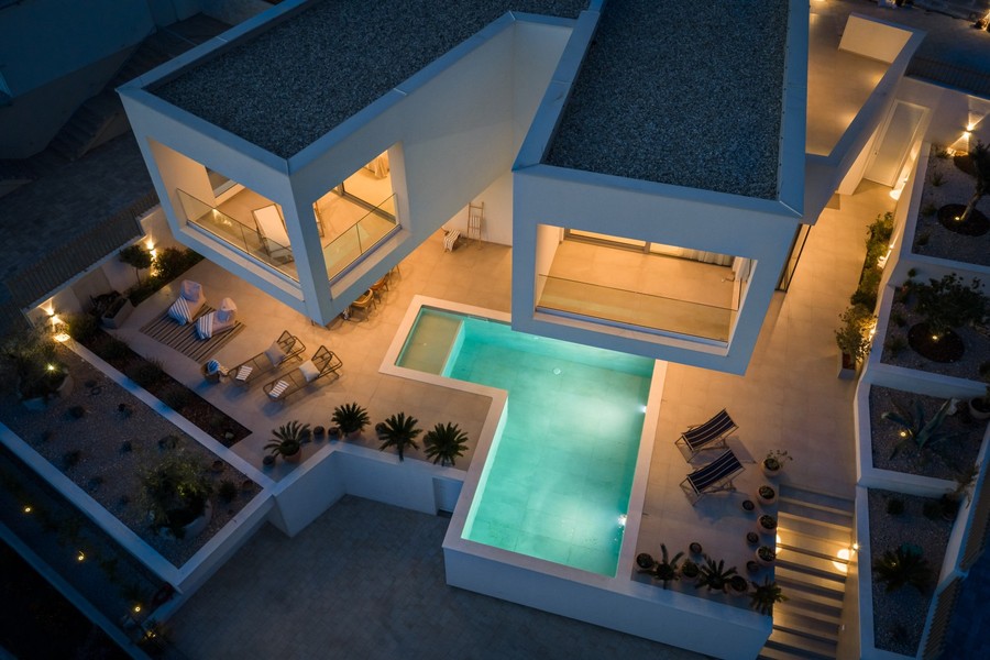 Aerial view of the villa with pool in the evening