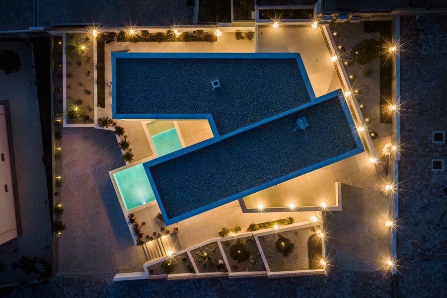 Villa with roof areas and pool seen from above