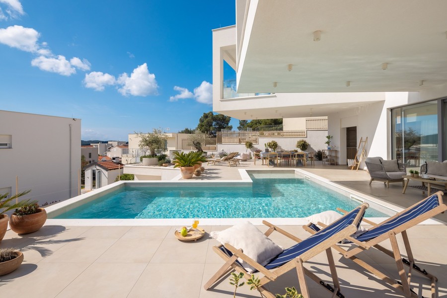 Pool with sun loungers and terrace