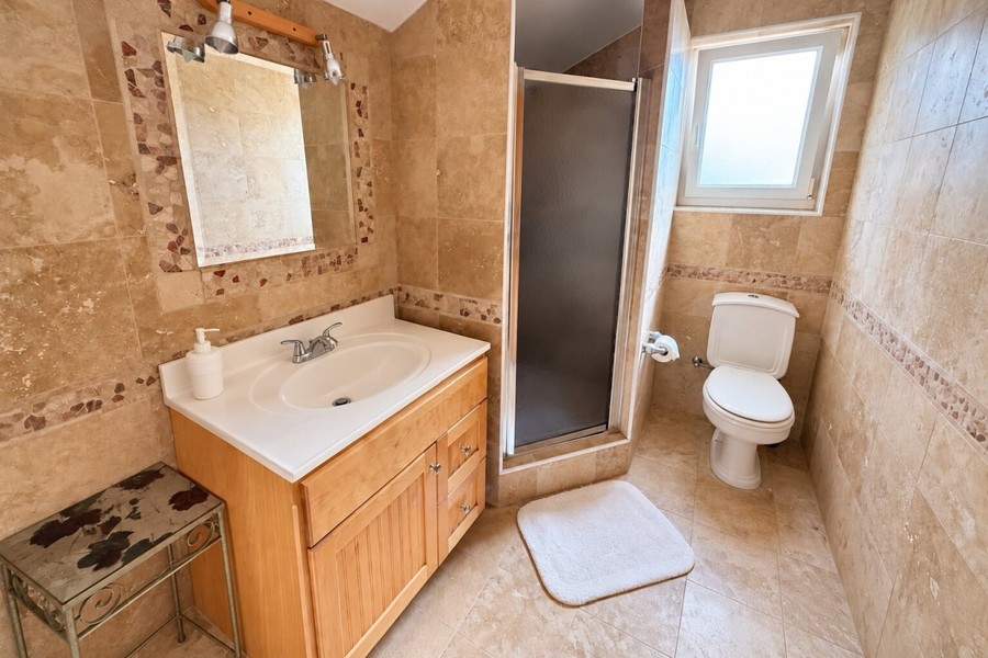 Bathroom with shower and window