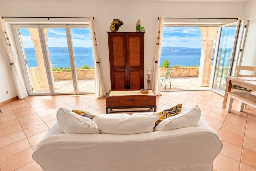 Living room with glass doors to the terrace