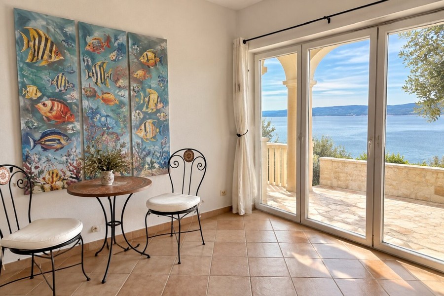 Seating corner with glass door to the terrace
