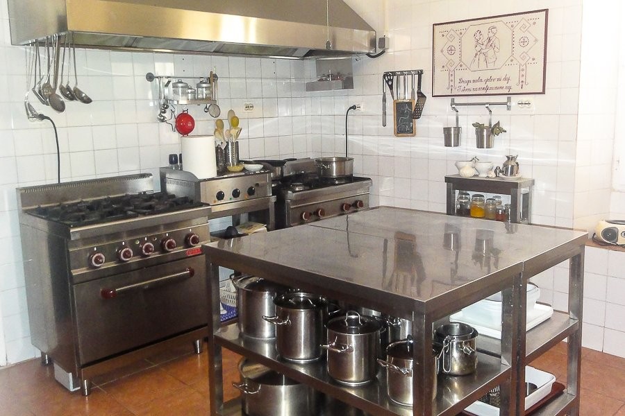 Kitchen with gas hobs and stainless steel worktop