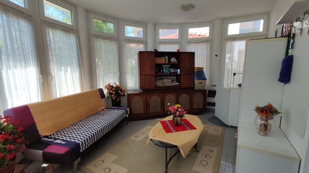 Bright living room with many windows