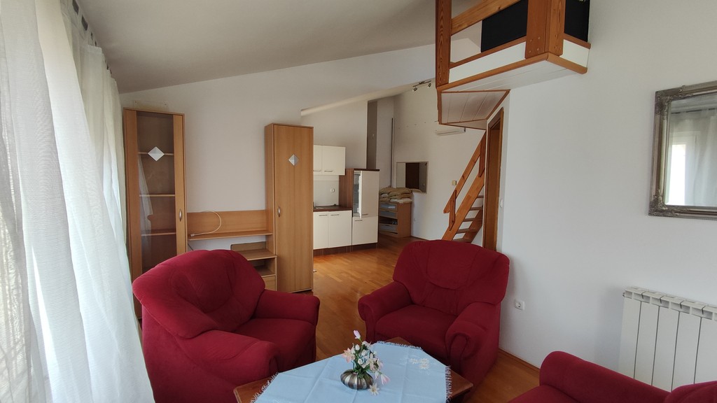 Living room with stairs to the sleeping gallery