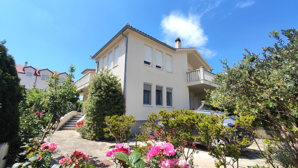 House exterior with flowering garden
