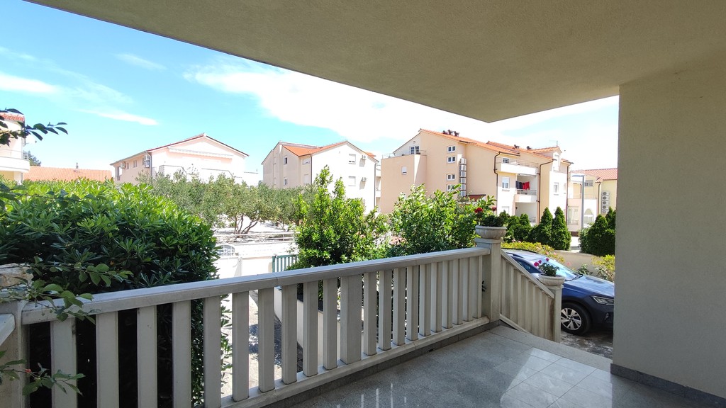 Covered terrace with railing