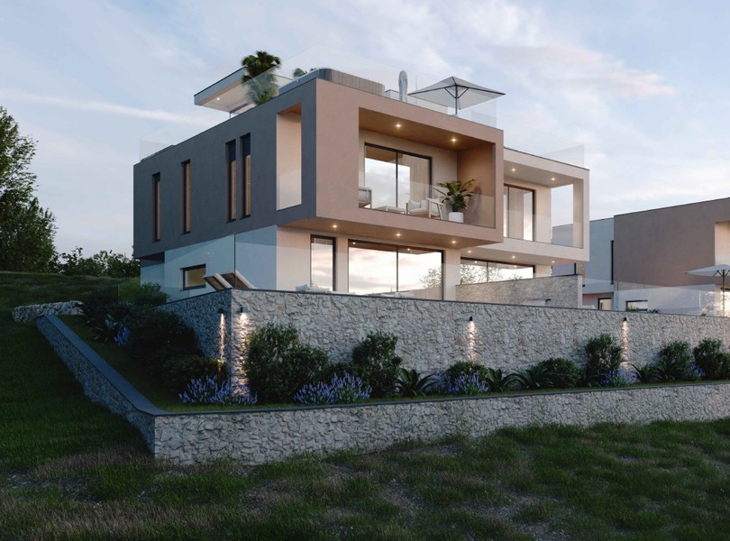 Side view of the house above the natural stone wall