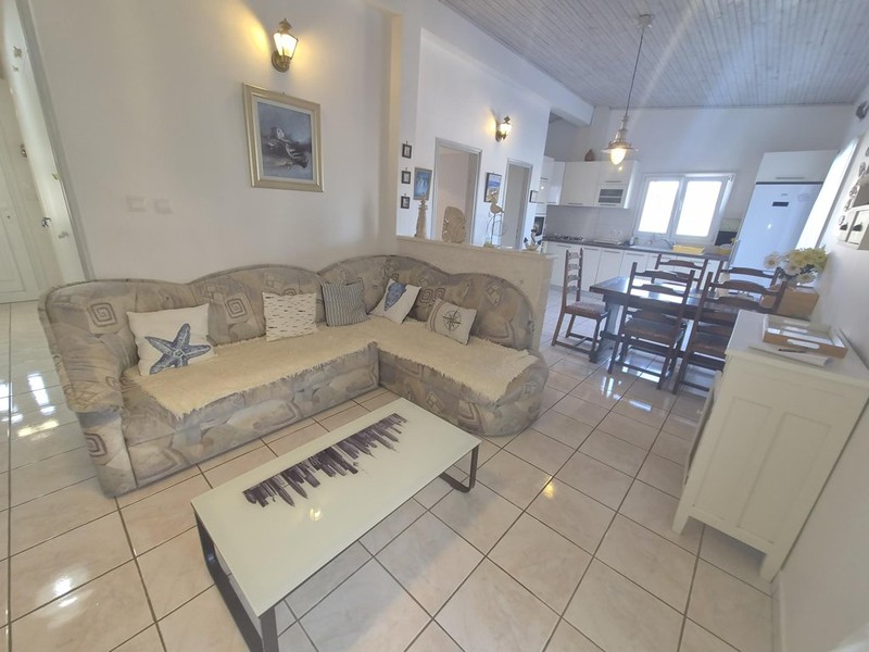 Living room with corner sofa and dining area
