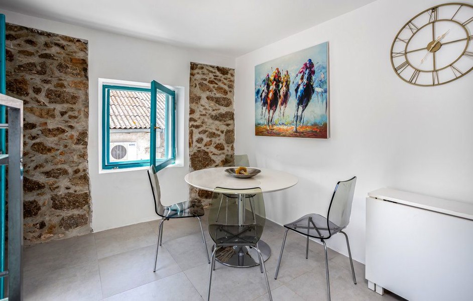 Round glass table with chairs by the window