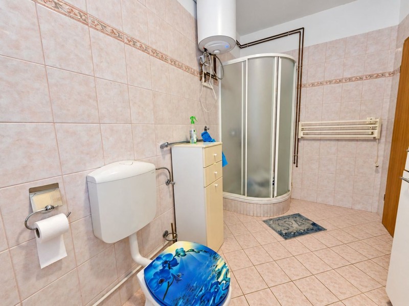 Bathroom with shower and water heater