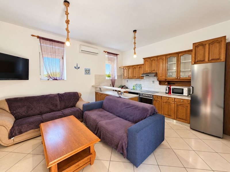 Living room with sofa and kitchenette