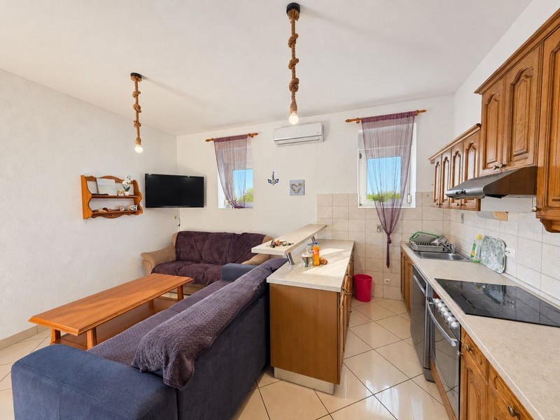 Living area with coffee table and kitchen