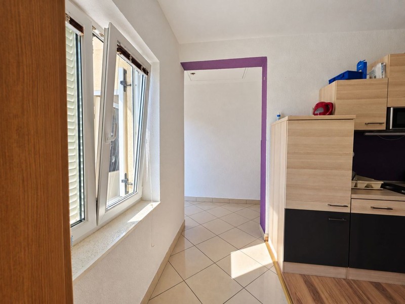 Hallway with view into the kitchen