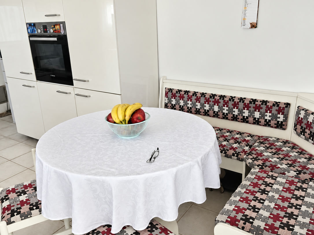 Kitchen with corner bench and round table
