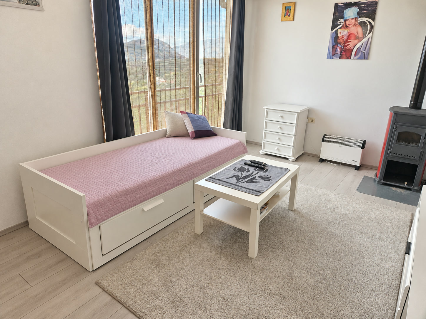 Bedroom with bed and view of greenery