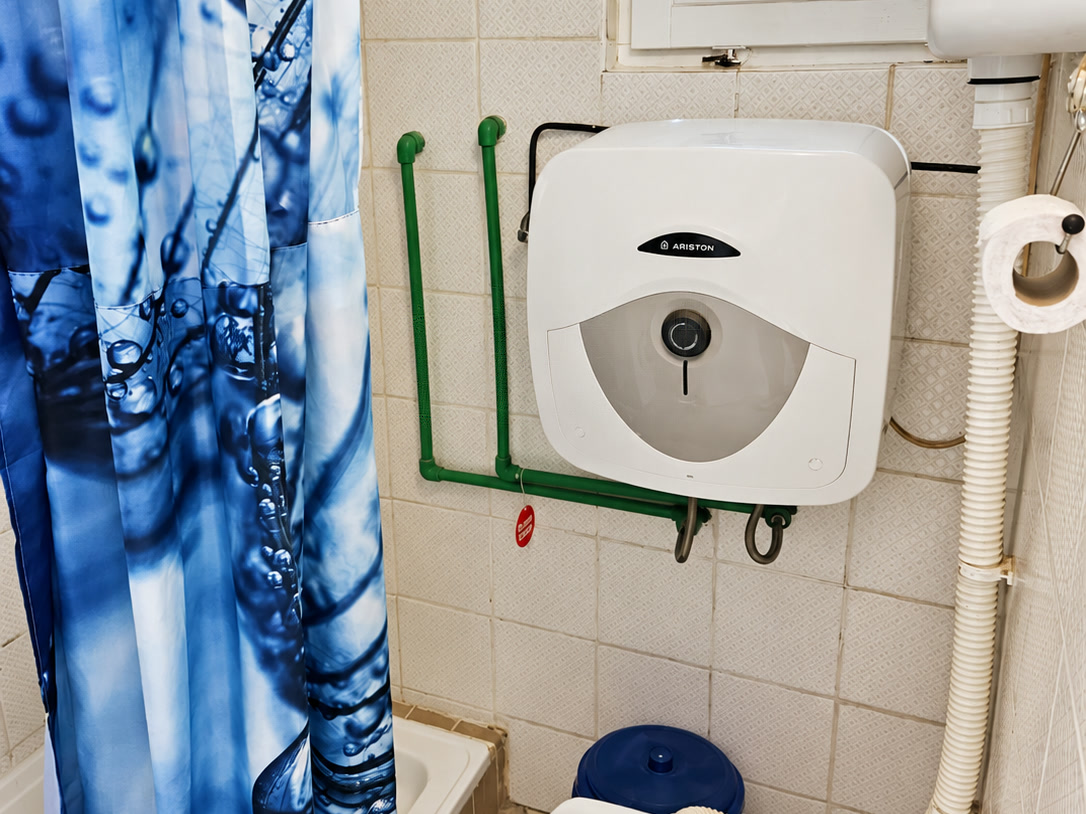 Toilet with window and water heater