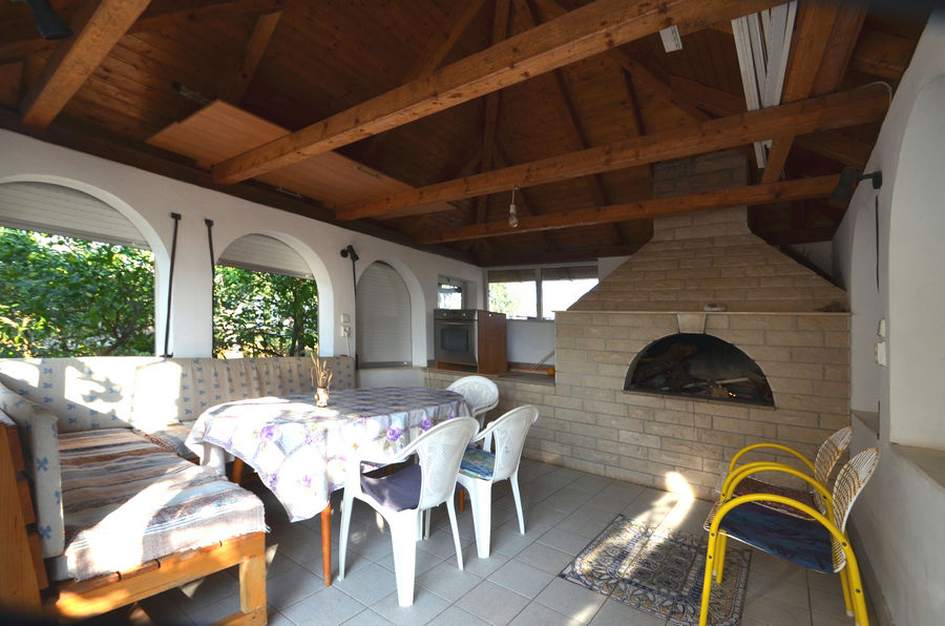 The summer arbor with barbecue fireplace