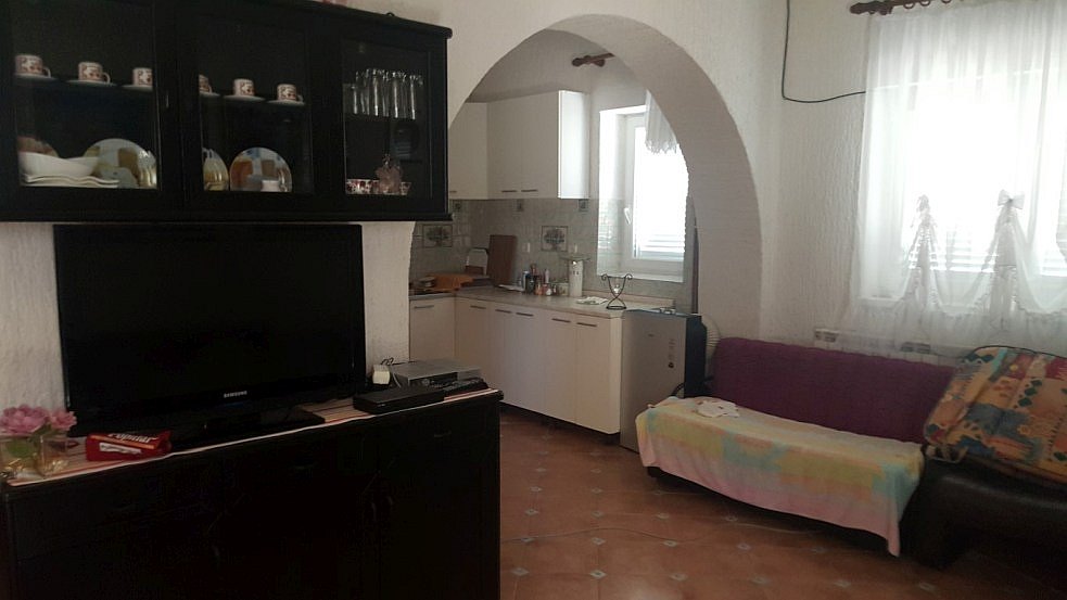 One of the living-dining rooms with kitchen of the villa on Pag that is for sale
