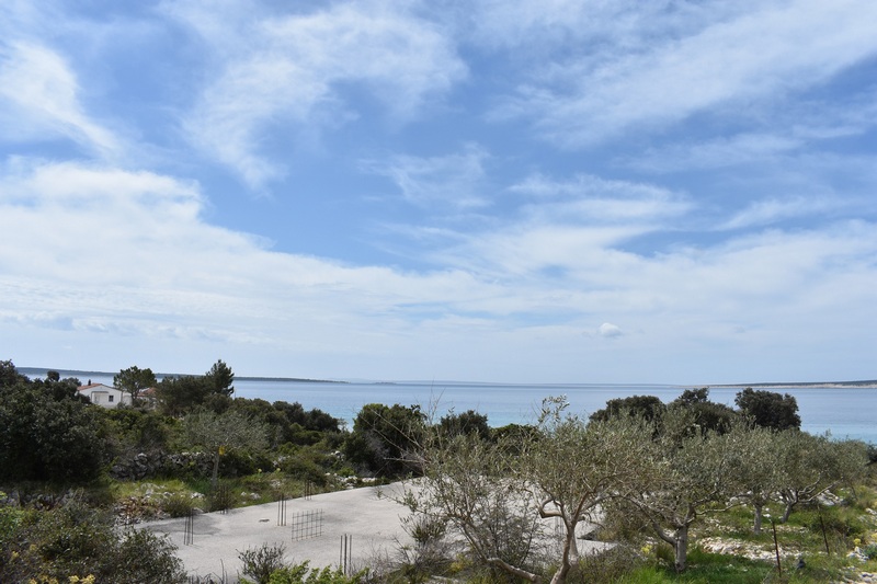 Concrete area in the grounds with sea views over the olive trees