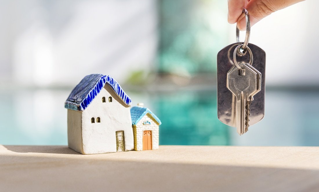 Key handover after a property purchase with a model house